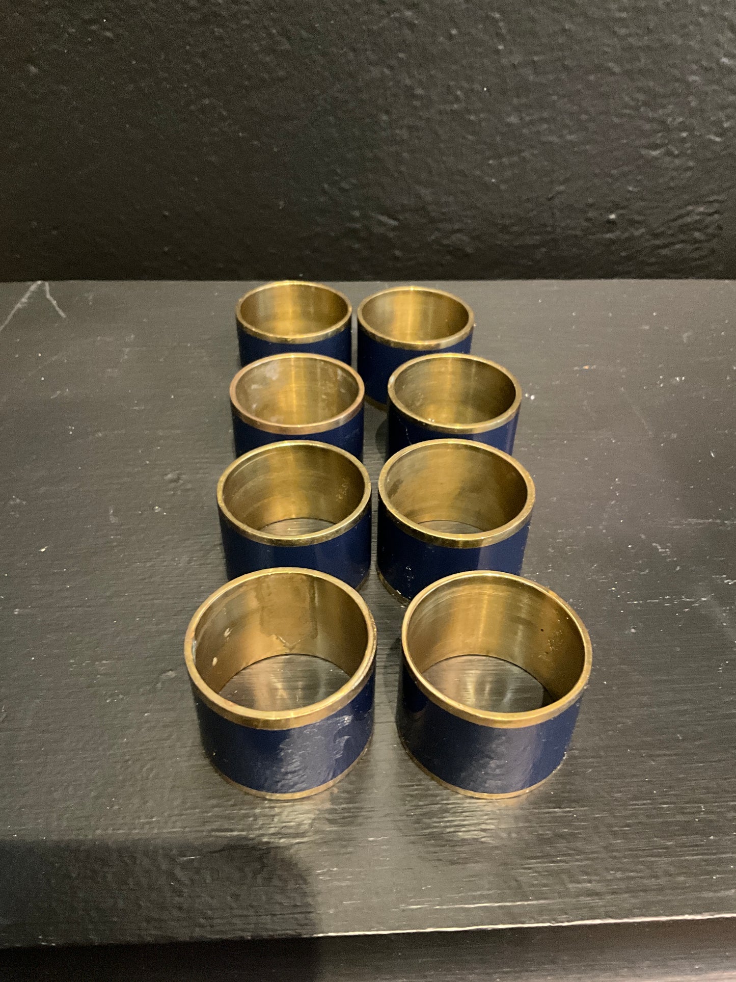 French brass and enamel napkin rings by Elizabeth, featuring intricate design and colorful enamel accents for elegant table settings.