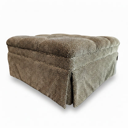 Square leopard print ottoman by The Vault Creative with plush fabric and sturdy wooden legs.