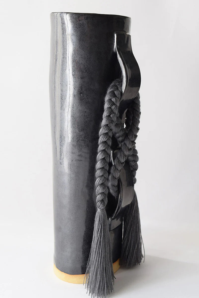 Black Karen Tinney Criss Cross Vase by Ozmun Home, featuring a stylish criss cross design and glossy ceramic finish.