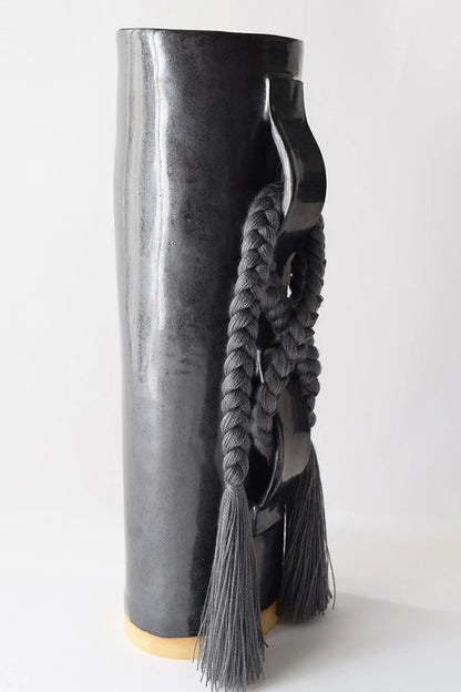 Black Karen Tinney Criss Cross Vase by Ozmun Home, featuring a stylish criss cross design and glossy ceramic finish.
