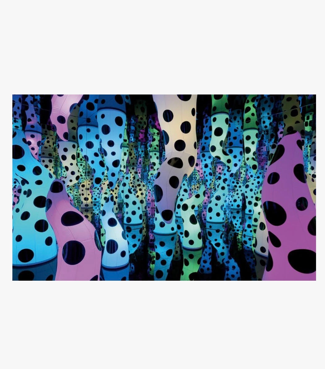 Book titled "Yayoi Kusama: Infinity Mirrors" by Ozmun Home featuring a colorful cover with artwork related to Kusama's mirror installations.