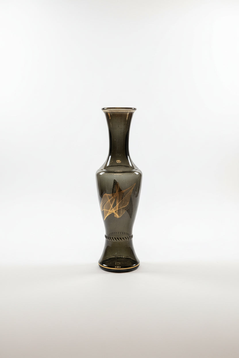 Glass vase with geometric line design by The Vault Creative, featuring a modern, clear glass shape with angular patterns.