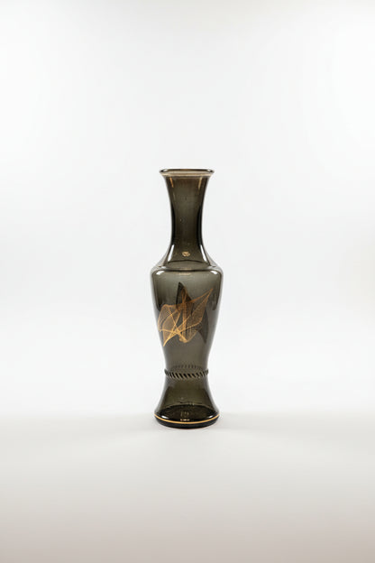 Glass vase with geometric line design by The Vault Creative, featuring a modern, clear glass shape with angular patterns.