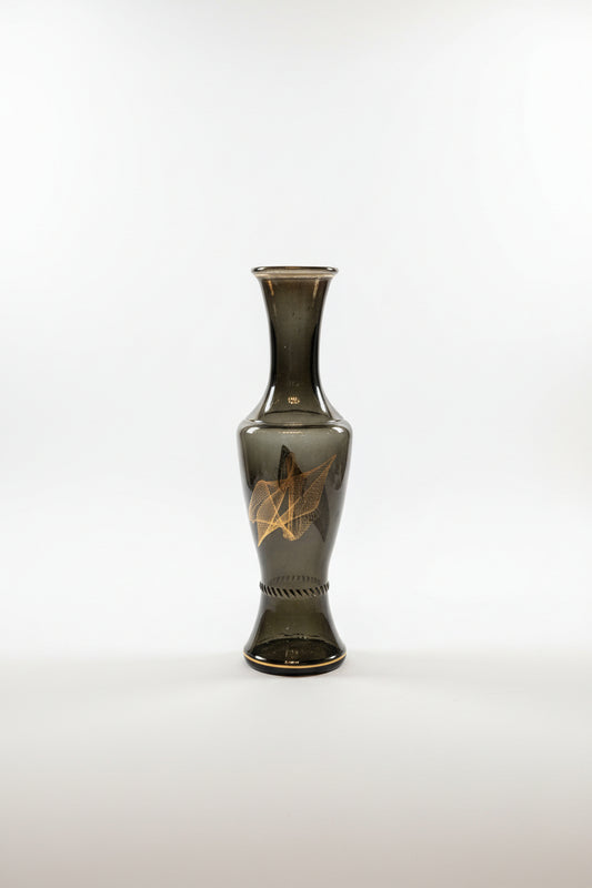 Glass vase with geometric line design by The Vault Creative, featuring a modern, clear glass shape with angular patterns.