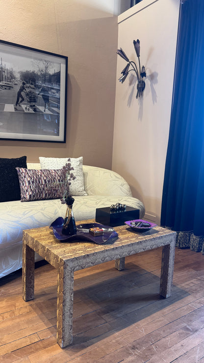 Vintage custom snakeskin coffee table by The Vault Creative, featuring a sleek rectangular design with textured snakeskin surface.