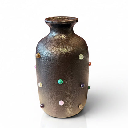 Marcia Bud Vase by P.Grunsfeld from The Vault Creative, featuring a sleek ceramic design with a narrow opening for floral arrangements.