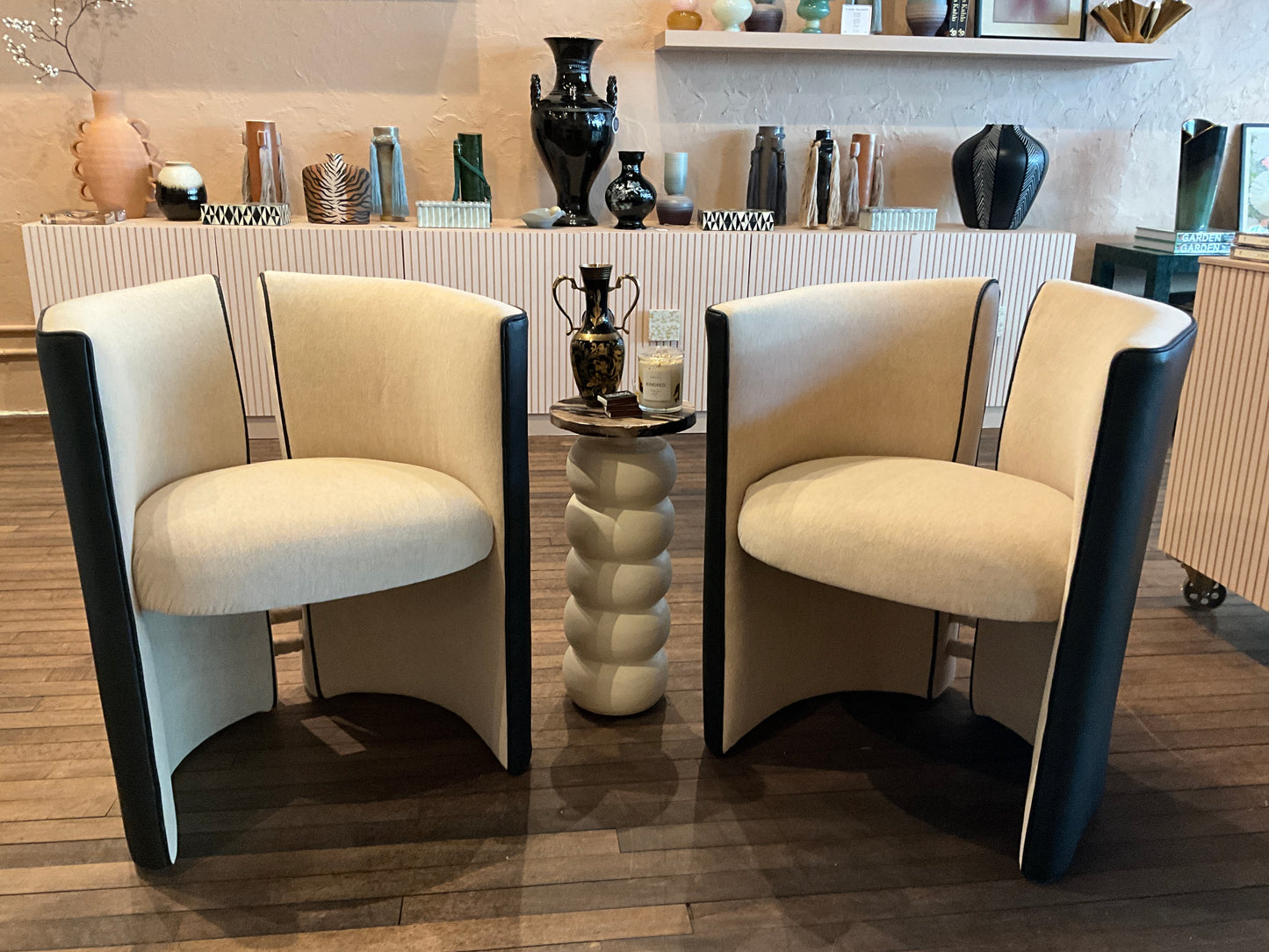 A stylish mohair and leather split back chair with wooden legs, featuring a modern design and plush upholstery.