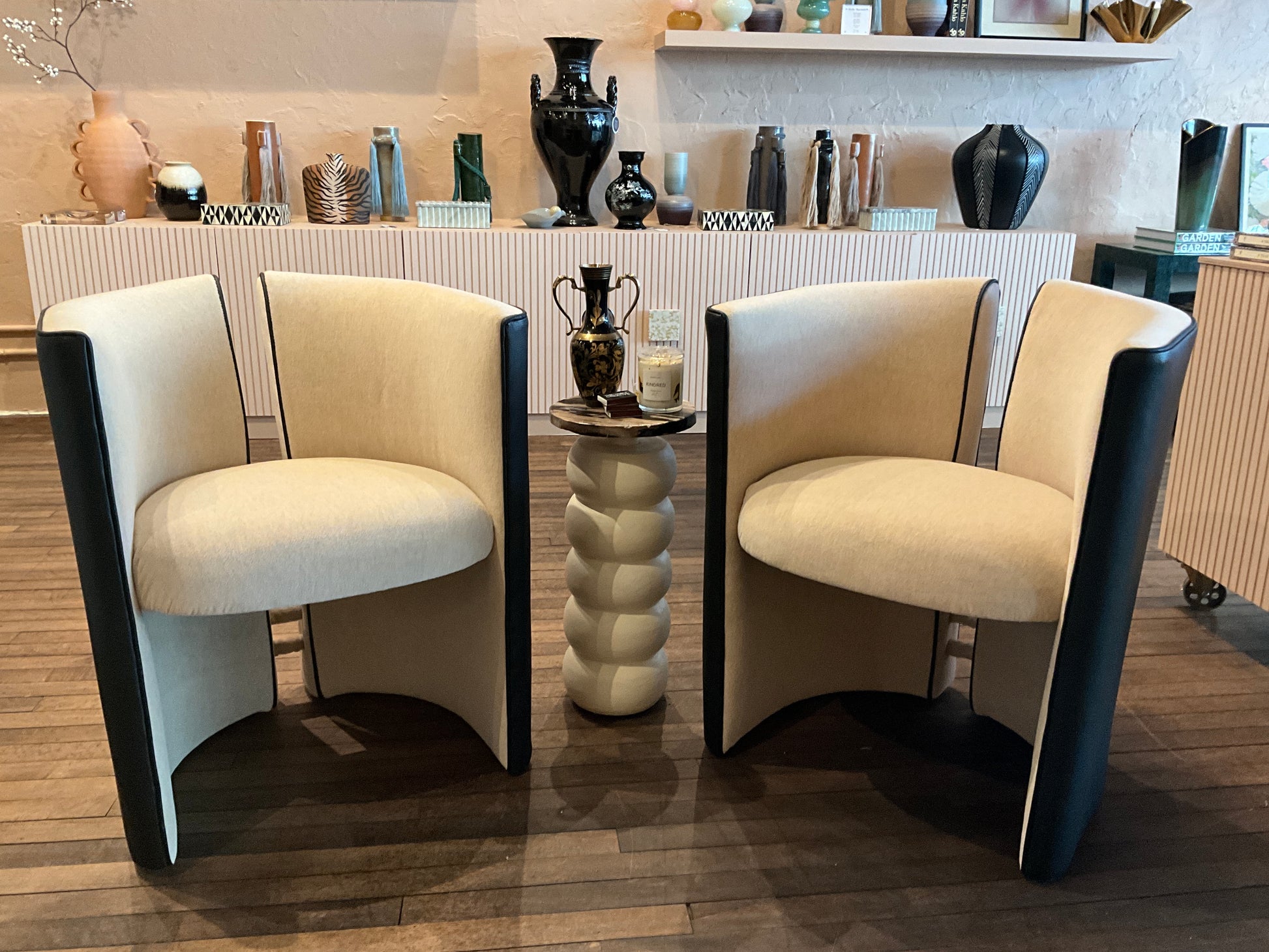 A stylish mohair and leather split back chair with wooden legs, featuring a modern design and plush upholstery.
