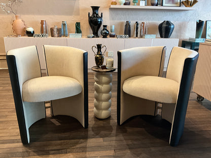 A stylish mohair and leather split back chair with wooden legs, featuring a modern design and plush upholstery.