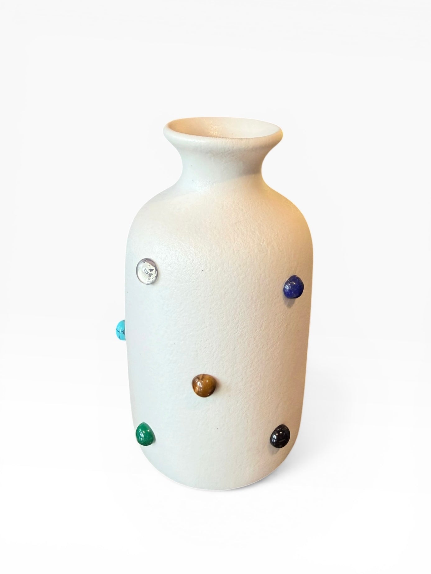 P.Grunsfeld Marcia Bud Vase by The Vault Creative, showcasing a sleek ceramic design with a narrow opening and textured finish.