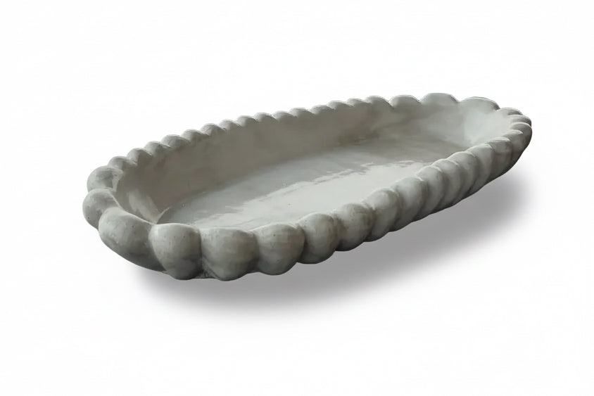 Handmade concrete bowl with antique marble finish from Atelier La Rouleuse, showcasing a smooth, rounded interior and textured exterior.