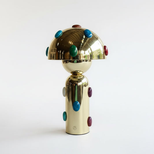 P. Grunsfeld Stoner Brass Wireless Lamp by The Vault Creative, featuring a sleek brass design and modern wireless functionality.