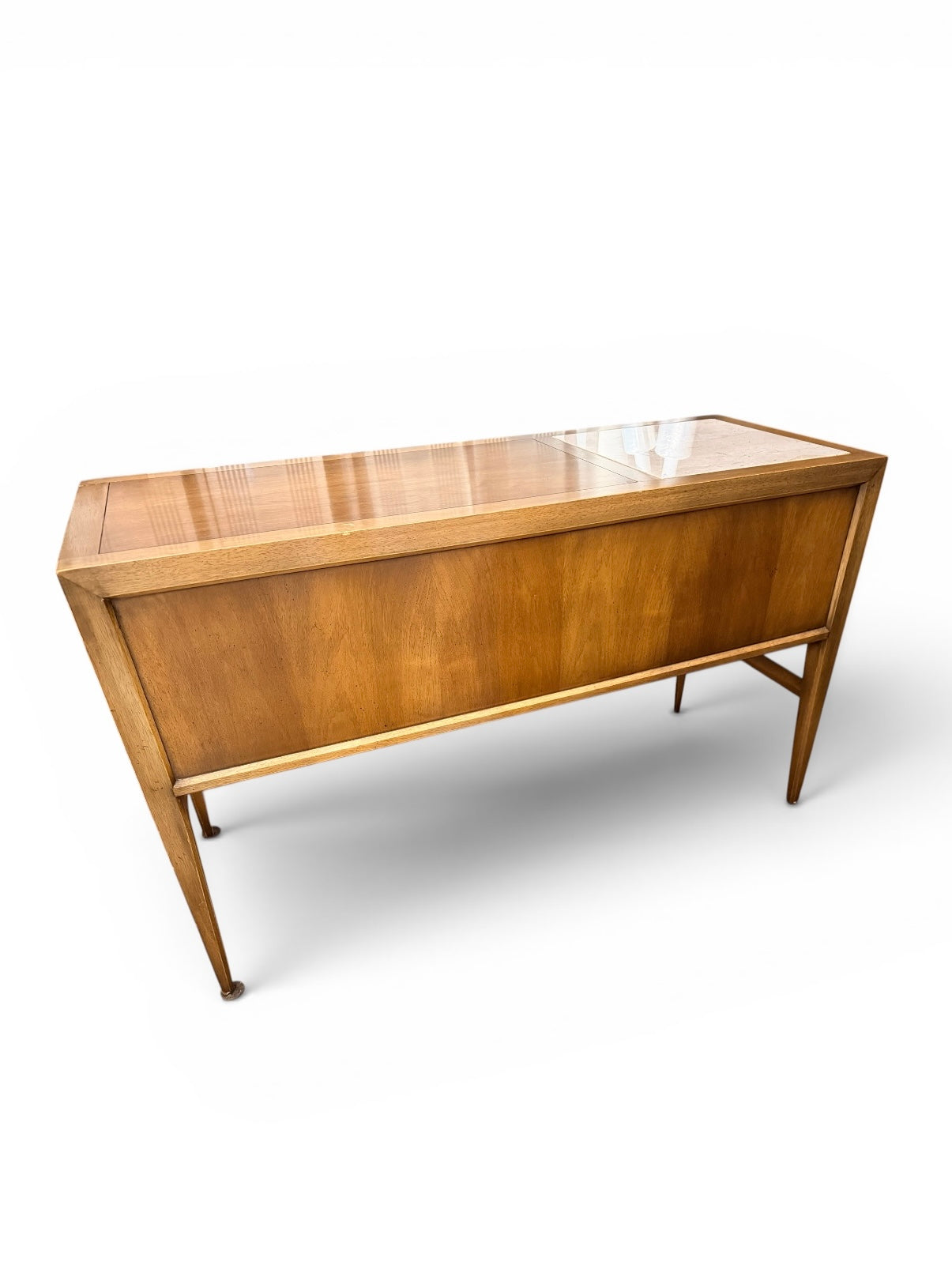 Mid-century console table by Ozmun Home with sleek wooden surface and tapered legs, ideal for entryways or living rooms.
