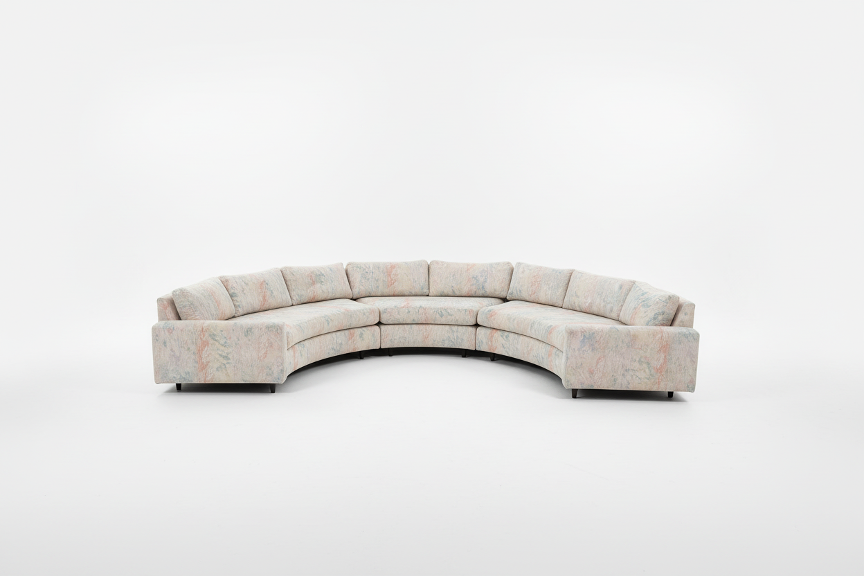 Vintage curved sofa by The Vault Creative, upholstered with plush fabric, featuring a stylish 1950s-inspired design.