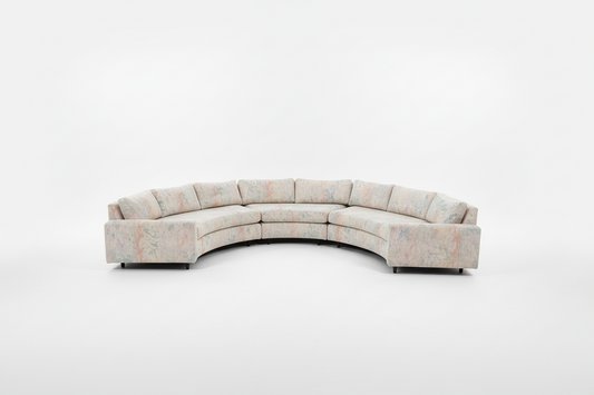 Vintage curved sofa by The Vault Creative, upholstered with plush fabric, featuring a stylish 1950s-inspired design.