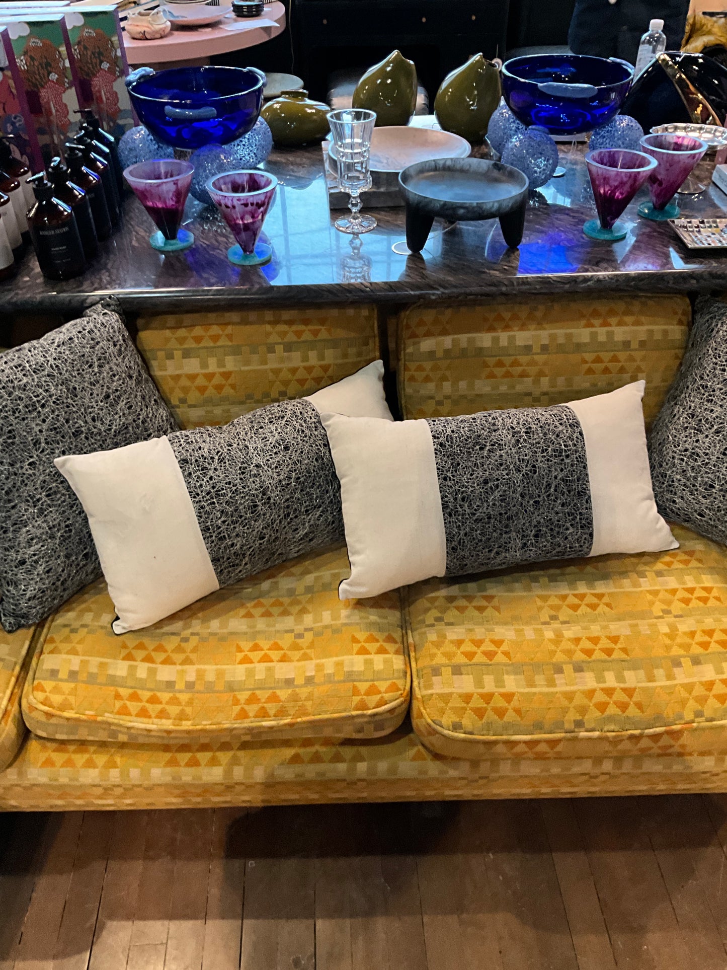 Silver and black metallic pillow by The Vault Creative featuring shiny, textured fabric for modern home decor accents.