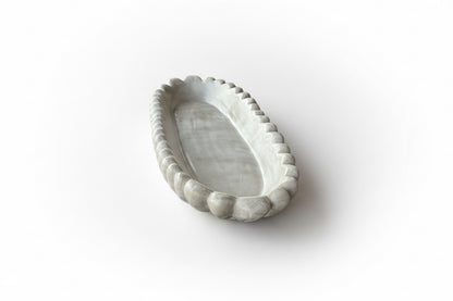 Handmade concrete bowl with antique marble finish by Atelier La Rouleuse, showcasing its textured surface and artisanal design.