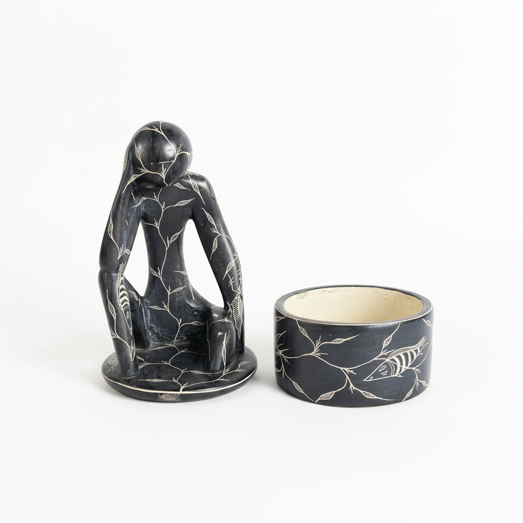 French carved jar by The Vault Creative featuring intricate patterns and a classic ceramic design.