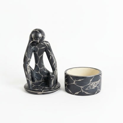 French carved jar by The Vault Creative featuring intricate patterns and a classic ceramic design.