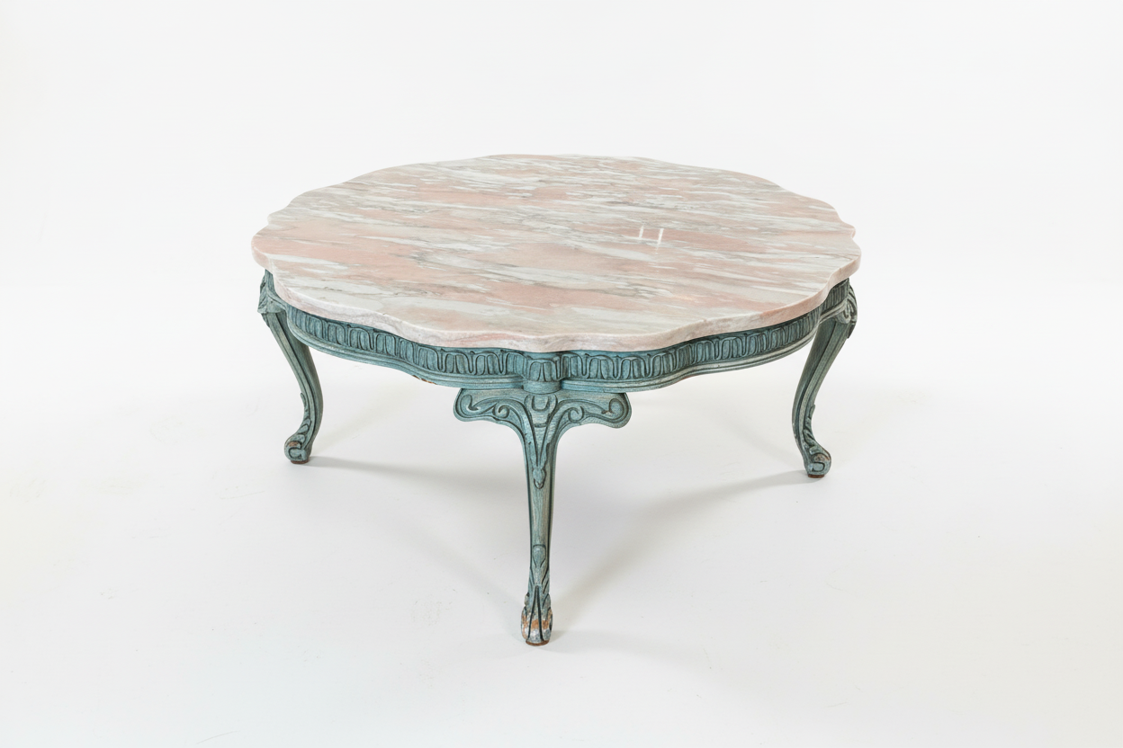 Pink marble coffee table by Ozmun Home with sleek round surface and modern design, perfect for living room decor.