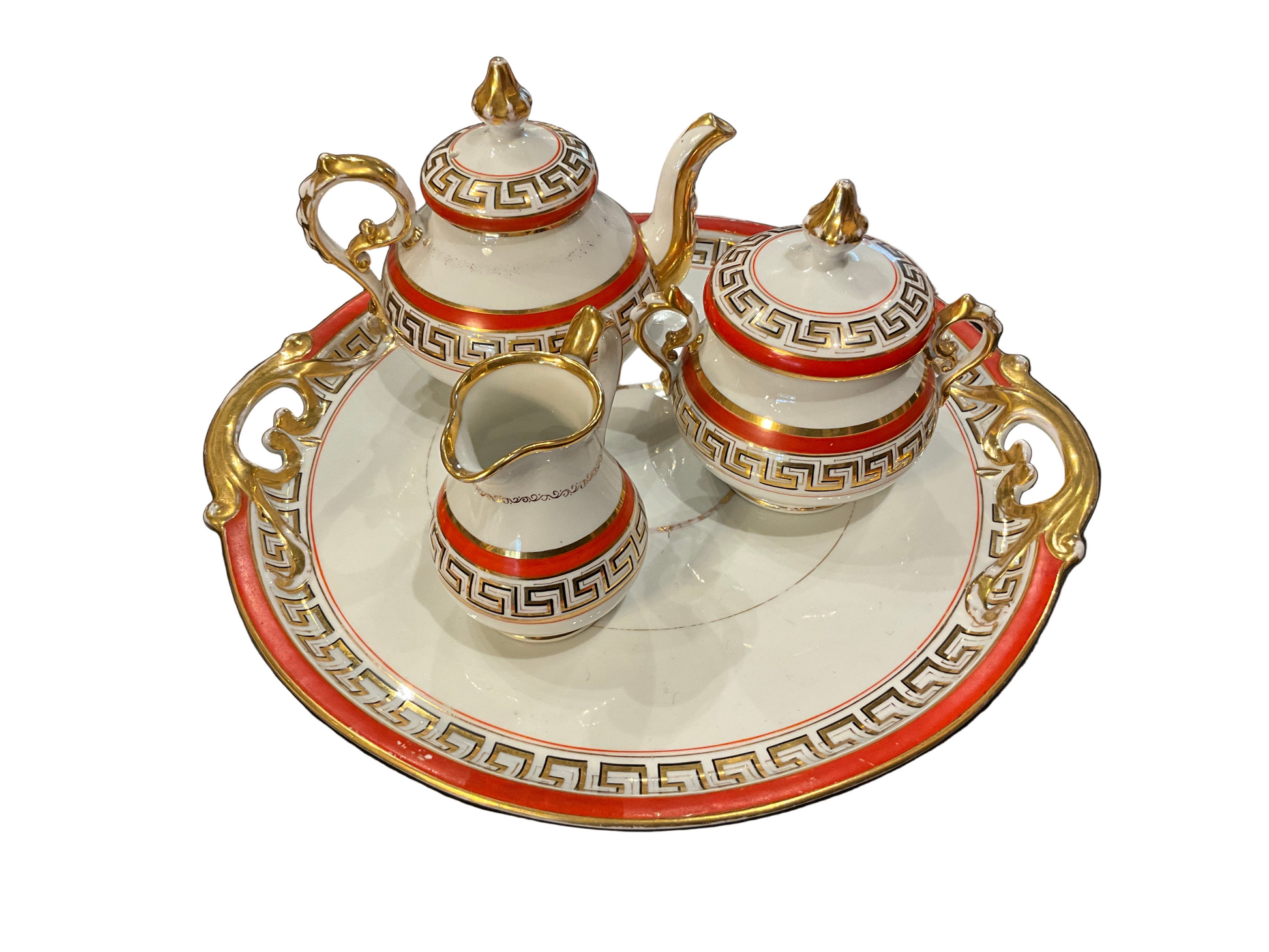 Vintage Greek tea set by The Vault Creative featuring delicate teapot, cups, and saucers with intricate patterns in soft pastel colors.