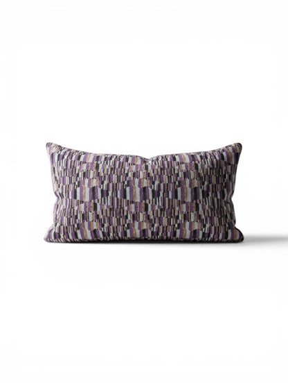 Small lumbar pillow by Stone Textile featuring soft fabric and ergonomic design for back support and comfort.