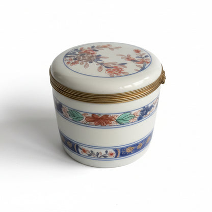 Vintage Limoges porcelain box with intricate hand-painted floral design, crafted by The Vault Creative.
