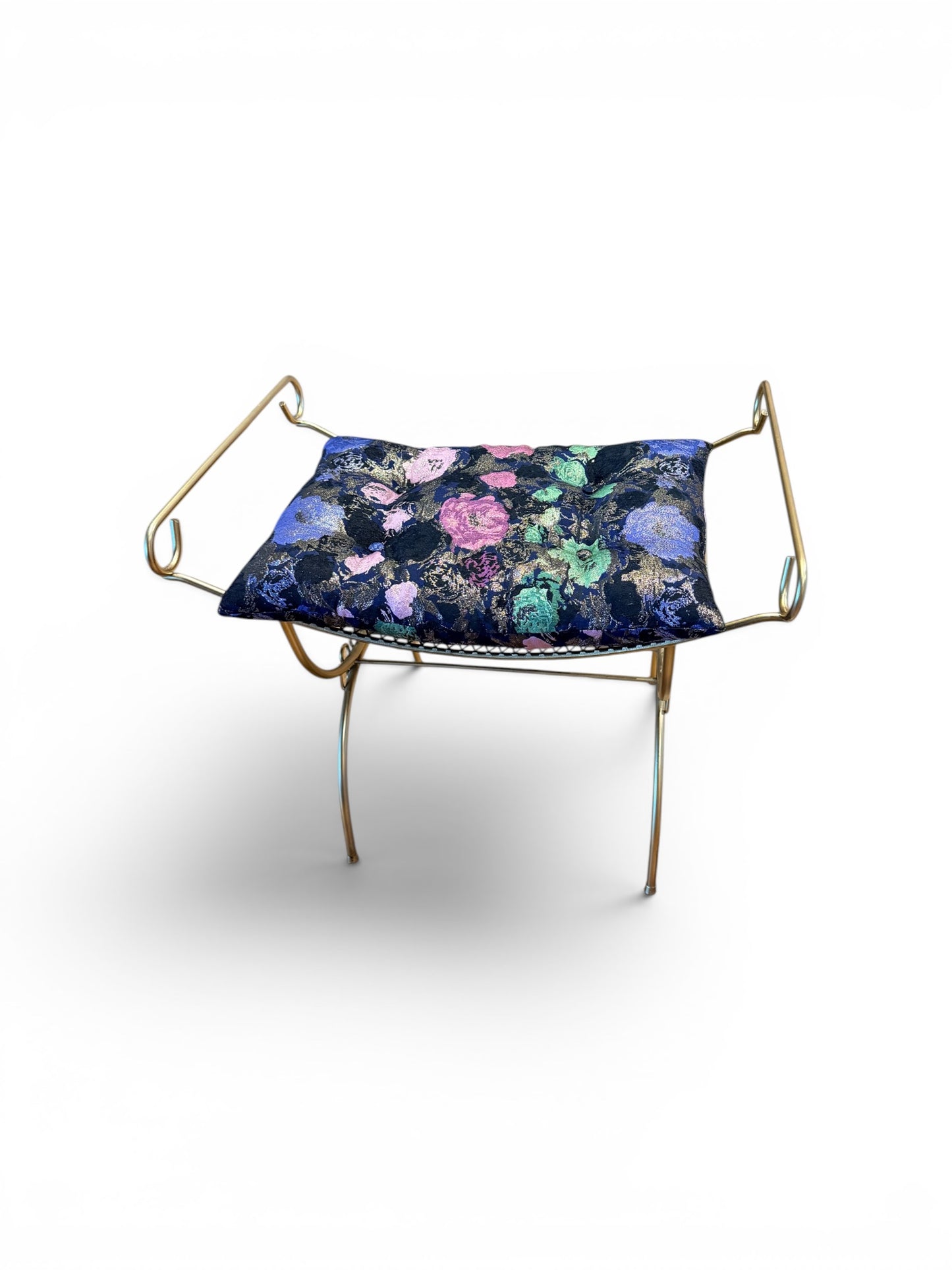 Vintage gold vanity bench by The Vault Creative with ornate design and cushioned seat, perfect for dressing area decor.