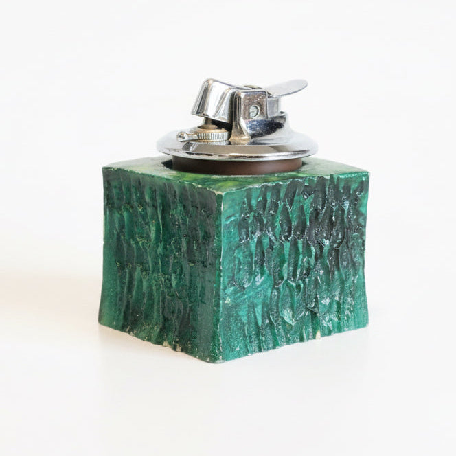 Vintage Ronson lighter with metal body and classic design, featuring a polished finish and vintage aesthetic.