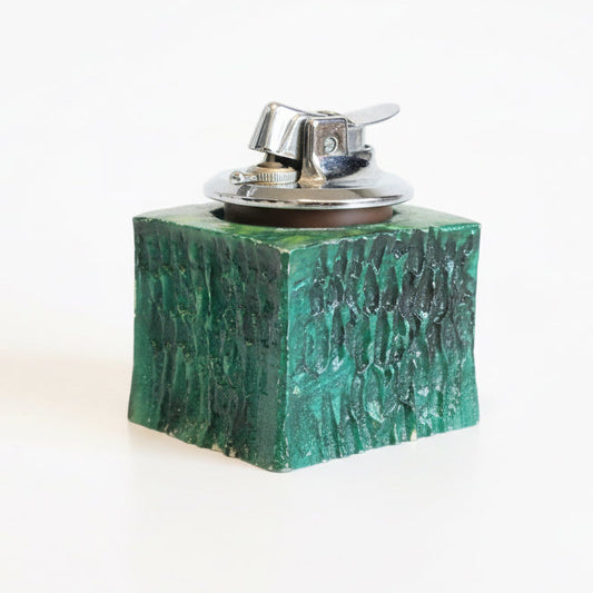 Vintage Ronson lighter by The Vault Creative with a classic metal body and intricate engraved design.