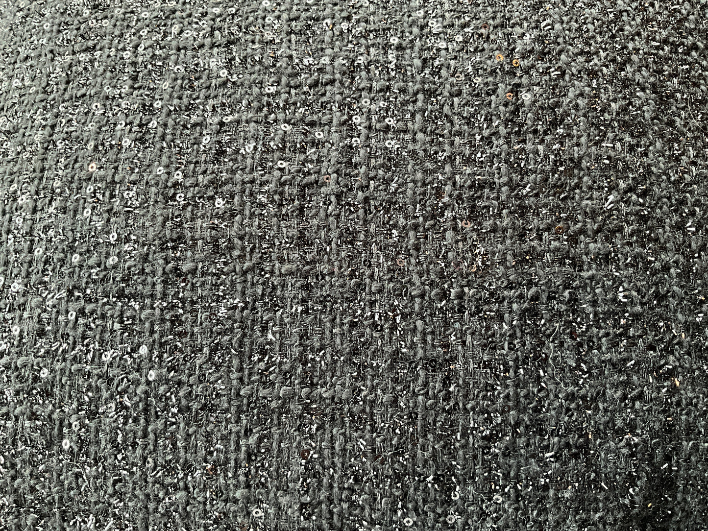 Black sequin and tweed pillow by The Vault Creative, featuring a textured, glamorous design for stylish home decor.