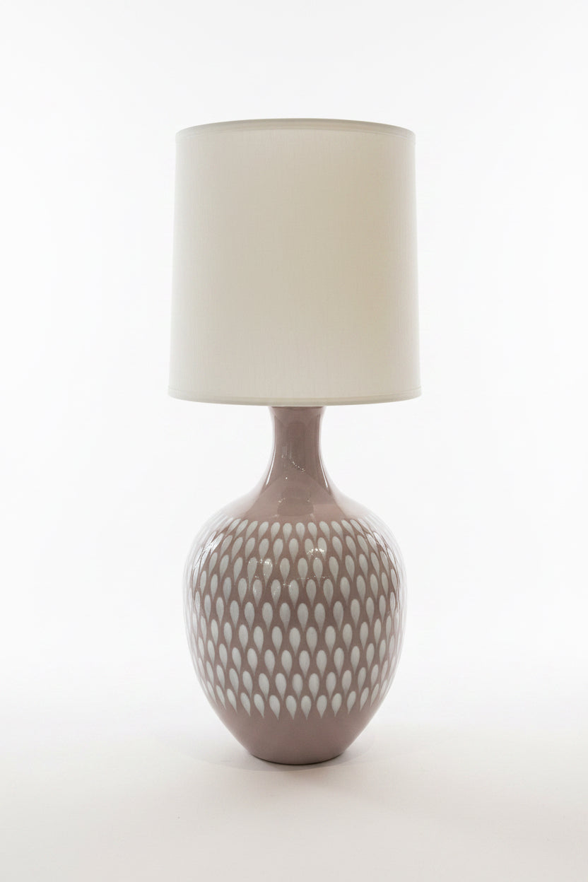 Dusty lavender 70s-style lamp by The Vault Creative with a retro design and modern finish, shown on a wooden surface.