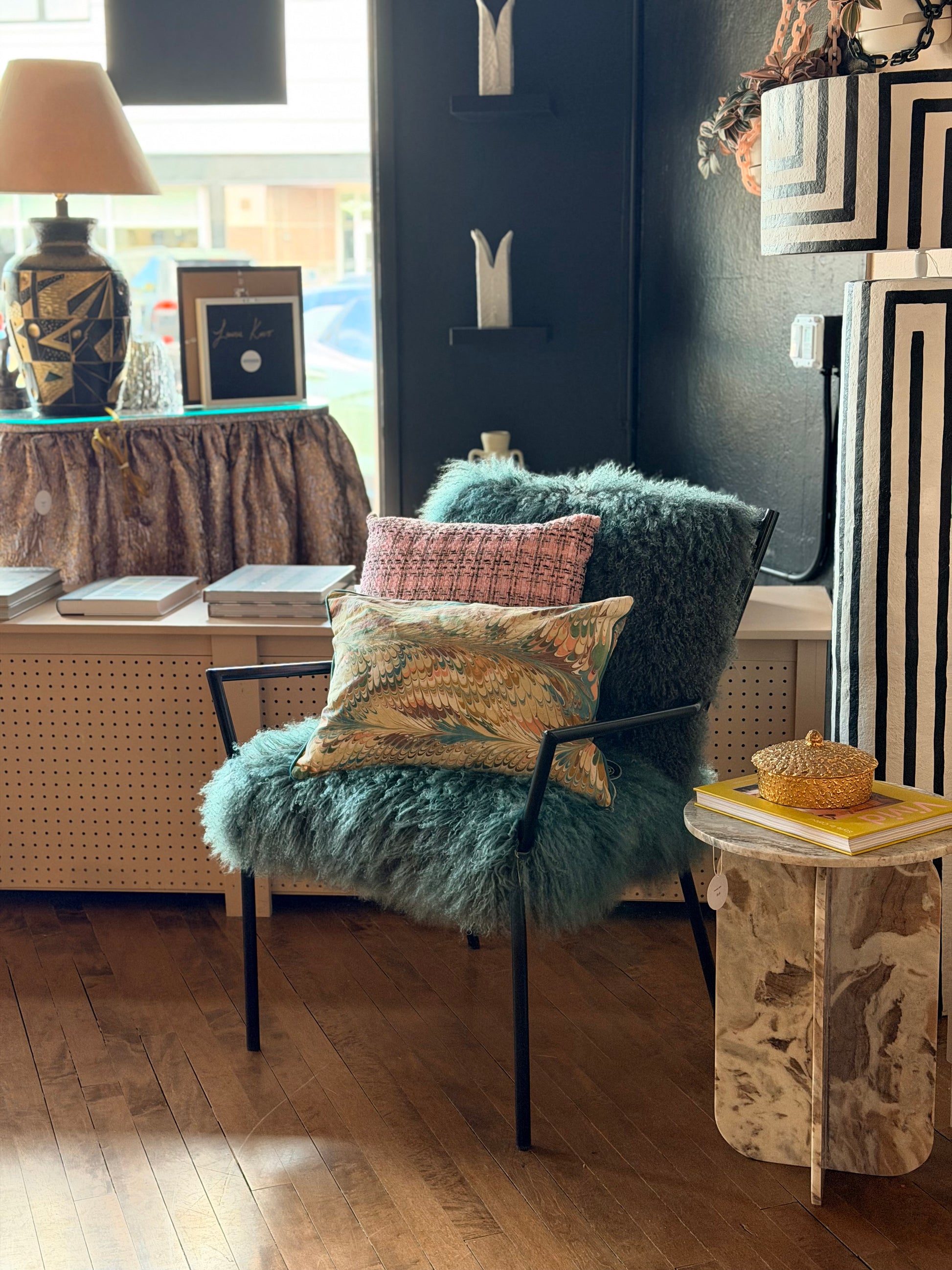 Curly Lamb Chair by The Vault Creative featuring plush curly lamb upholstery and a modern, stylish design.