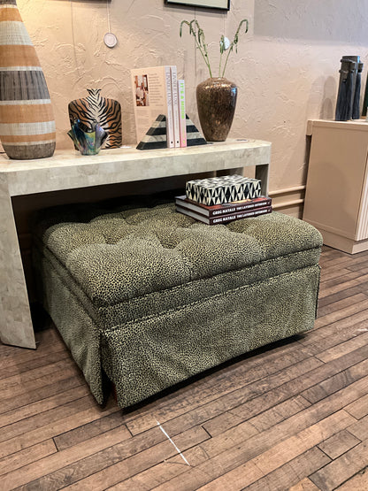 Square leopard-patterned ottoman by The Vault Creative, showcasing a stylish upholstered piece with a bold animal print design.