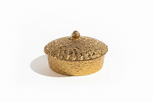 24k powdered gold dish by The Vault Creative, showcasing a small elegant container with shimmering gold powder inside.