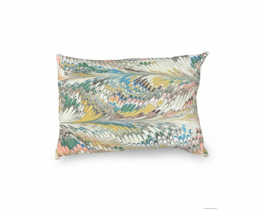 Hand-marbled pillow featuring flatiron feathers design by The Vault Creative, showcasing vibrant, artistic textile craftsmanship.