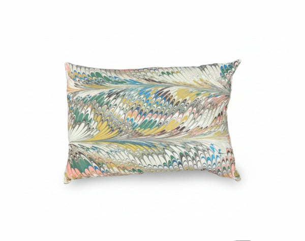 Hand-marbled pillow featuring flatiron feathers design by The Vault Creative, showcasing vibrant, artistic textile craftsmanship.