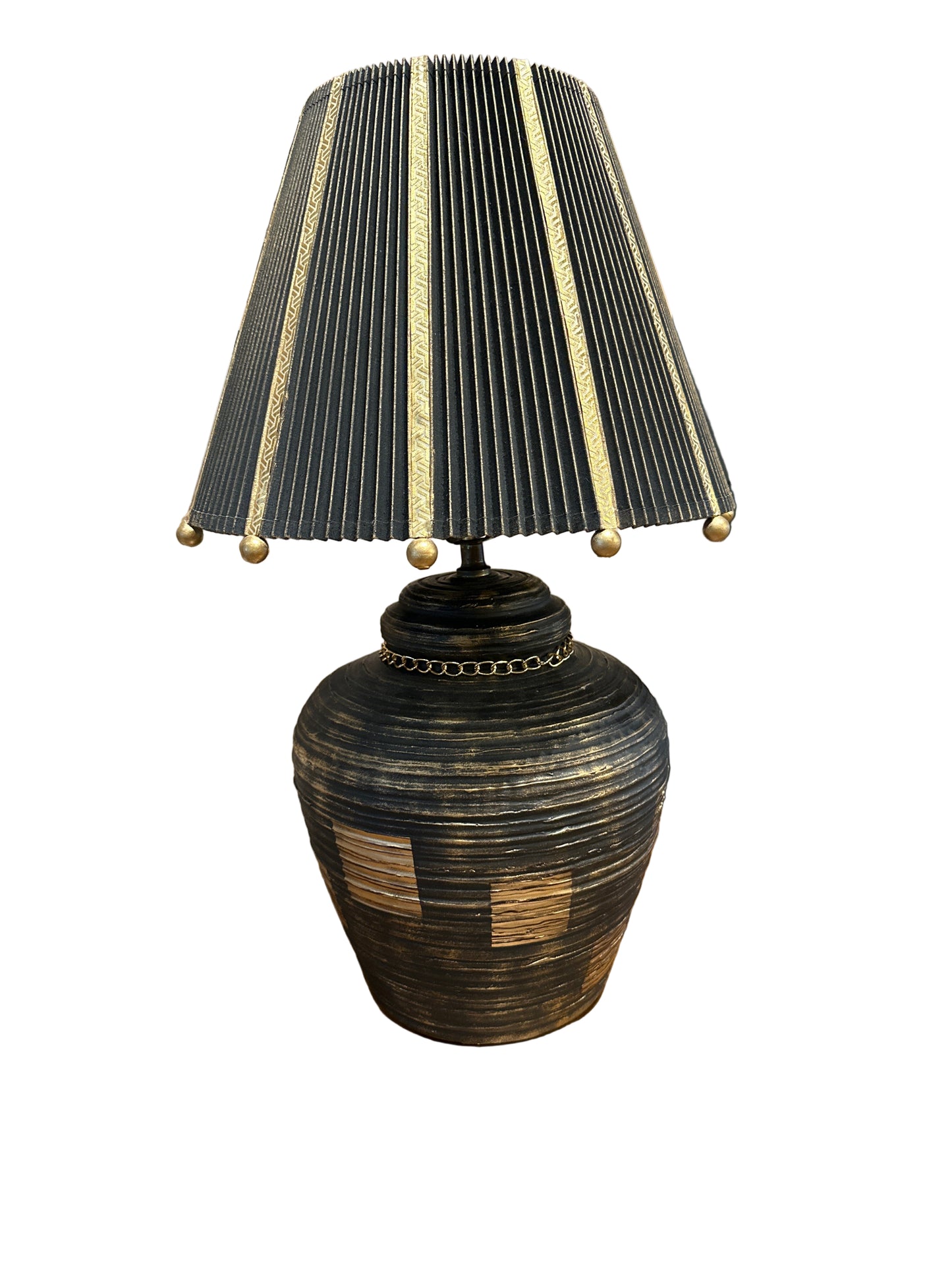 Vintage ceramic glam lamp by The Vault Creative with a stylish, decorative design and a warm illuminated glow.