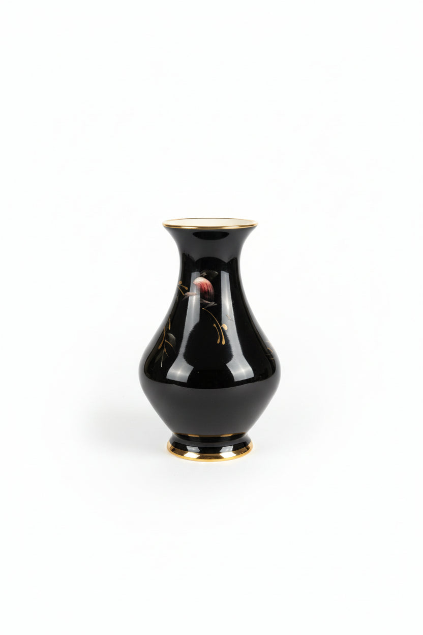 Vintage flower vase by The Vault Creative with intricate floral patterns and a classic ceramic design.