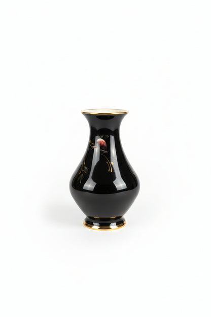 Vintage flower vase by The Vault Creative with intricate floral patterns and a classic ceramic design.