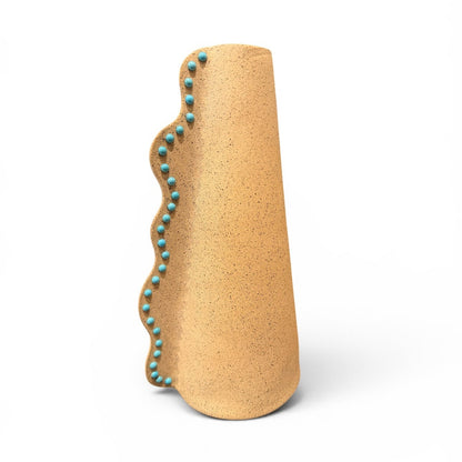 Ceramic Wavy Vase by P. Grunsfeld from The Vault Creative, featuring a glossy, flowing design in neutral tones.