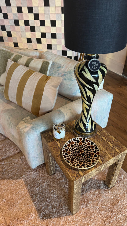 Vintage snakeskin side coffee table by The Vault Creative featuring a sleek, textured snakeskin pattern and modern design.