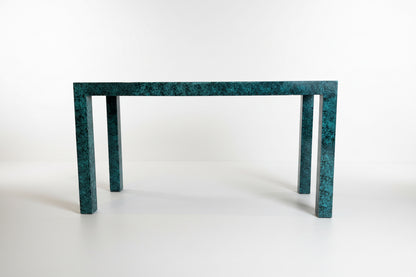Faux malachite console table by The Vault Creative with sleek black legs and vibrant green malachite pattern surface.