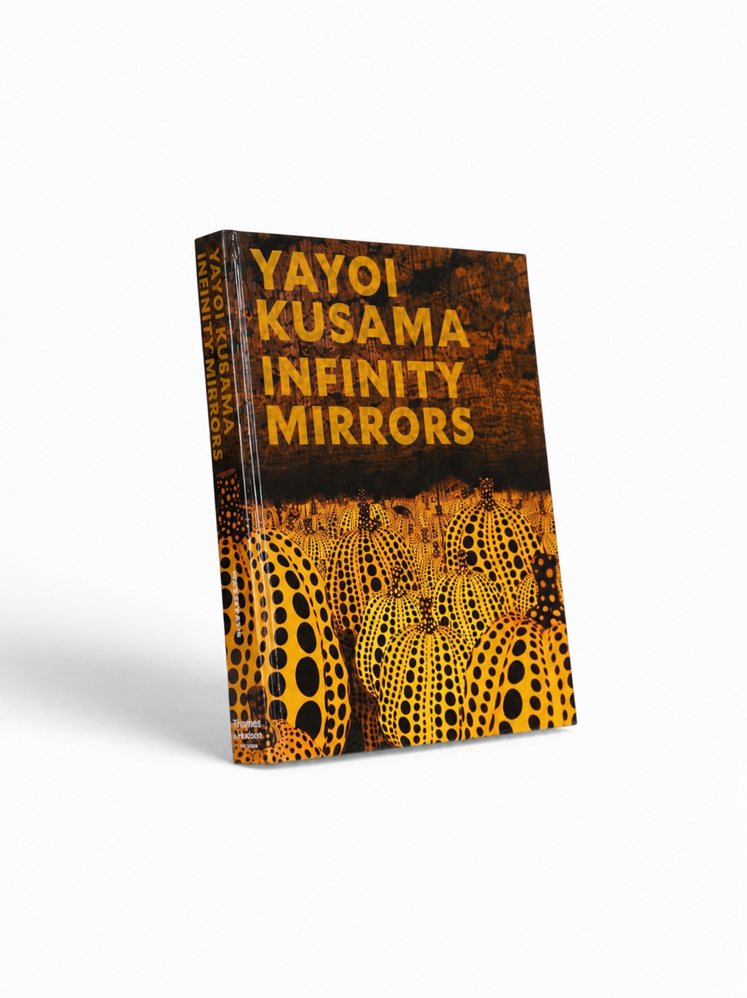 Open book of Yayoi Kusama: Infinity Mirrors featuring vibrant images and detailed descriptions of her iconic mirror artworks.
