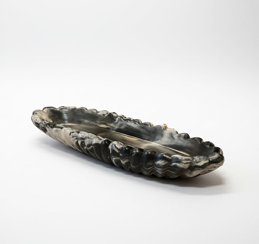 Handmade Forma XXL concrete bowl by Atelier La Rouleuse with dark marble finish, showcasing its textured modern design.