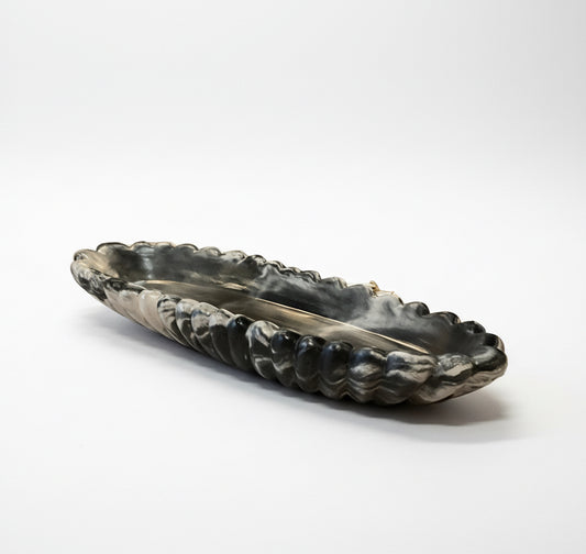 Handmade Forma XXL concrete bowl by Atelier La Rouleuse with dark marble finish, showcasing its textured modern design.