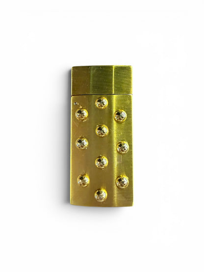 P. Grunsfeld Stoner Lighter by The Vault Creative, close-up of sleek metal lighter with engraved design and ignition mechanism.