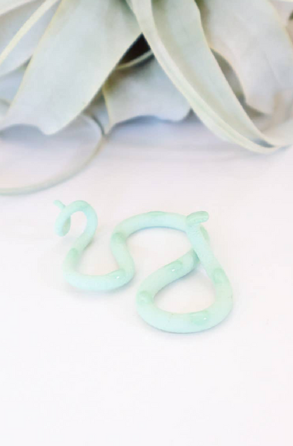 Honeydew snake plush toy from The Vault Creative, featuring soft fabric and vibrant green scales, realistic snake design.