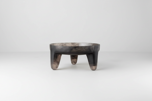 Saardé smoke-colored resin structured fruit bowl with a modern, textured design on a neutral surface.