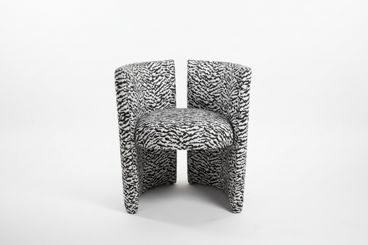 Black and white tiger print chair by The Vault Creative featuring a bold animal pattern and modern design.